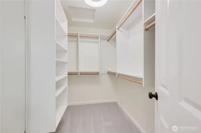 Walk-in closet in primary bathroom