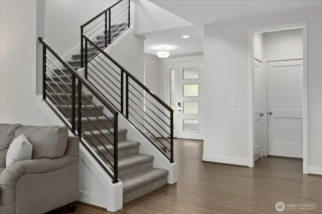 Modern design and hardwood floors create elegant living