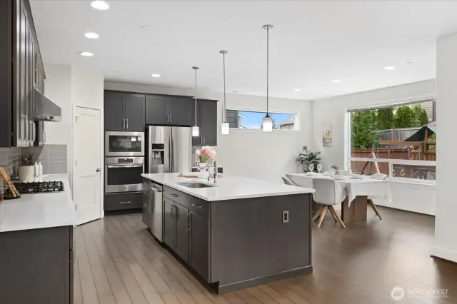 The heart of the home features modern finishes and soaring ceilings, perfect for entertaining