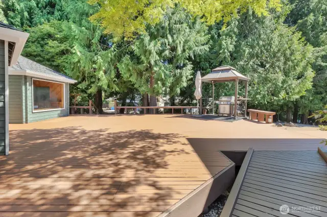 Huge deck features BBQ gazebo, 12-person free-standing sauna & 3/4 bath