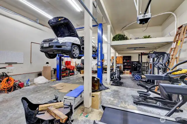 Space for 2-car tandem is currently occupied by fully equipped gym with treadmill, elliptical, free weights, cable machines, squat rack