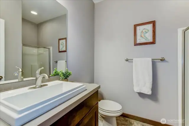 Main floor 3/4 bath. Excellent for those wanting to utilize the main floor room as a bedroom.