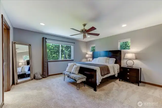 Large primary suite overlooks backyard. Plenty of space for your large bedroom furniture.