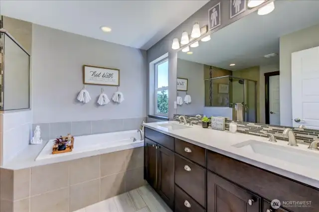 Primary bath is a 5-piece bath, with dual undermount sinks, shower, soaking tub, water closet and walk-in closet.
