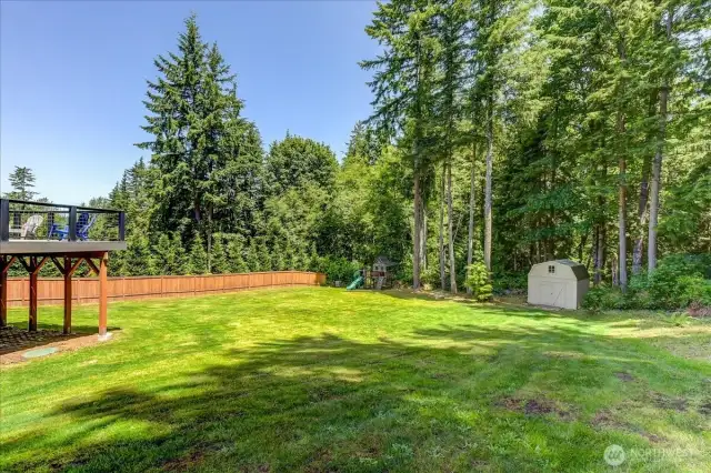 Over 1/2 acre backing to the forest.  Garden shed for your yard tools and toys.