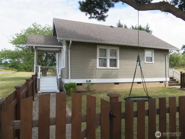 Fully fenced side yard.  Room for more garden here!