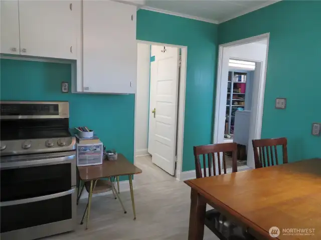 From the kitchen to the full bath.  Side entry and the utility room to the right.