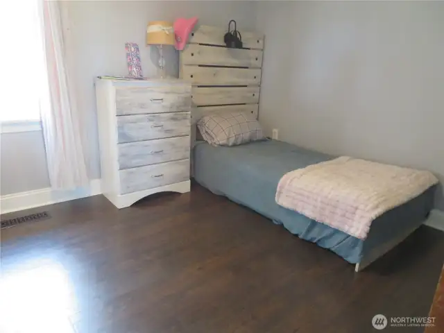 Second bedroom with a good-sized closet to the left. Ceiling fans in both bedrooms.