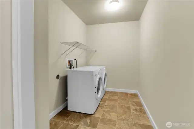 The laundry room is conveniently located between the four upper level bedrooms.  This room is extra spacious and has a large linen closet, plus a clothes hanging area.