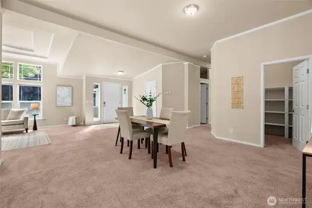 Gather around for meals or celebrations in this inviting dining space, perfectly positioned to enjoy natural light and easy access to the kitchen and living areas.