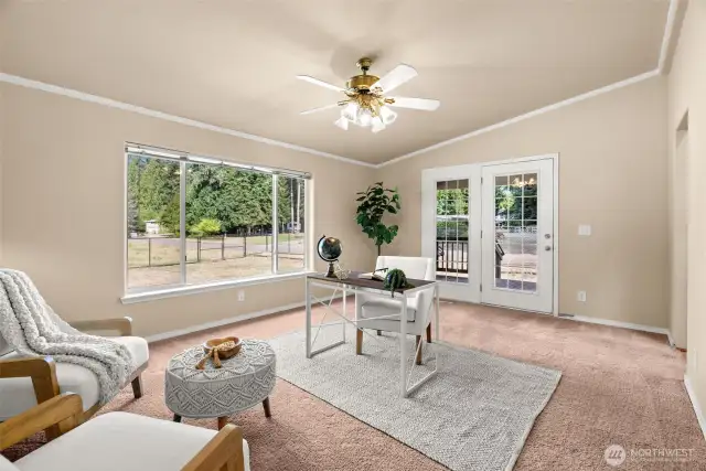 Perfect as a home office, family room, or creative space, with French doors offering easy access to the covered deck.