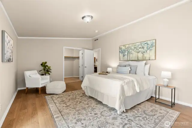 Inviting layout with warm flooring, soft tones, and seamless access to the walk-in closet.