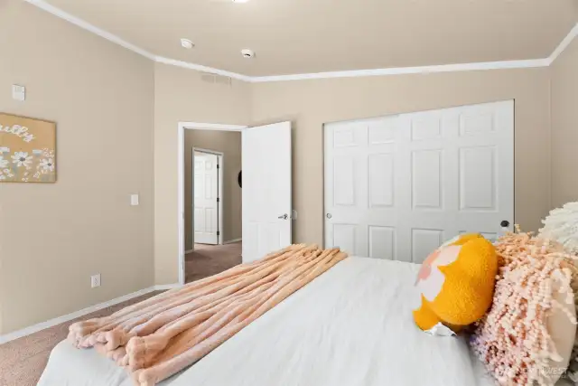 At the end of the hall, you’ll find two generously sized bedrooms—each with double-door sliding closets for easy storage and organization.