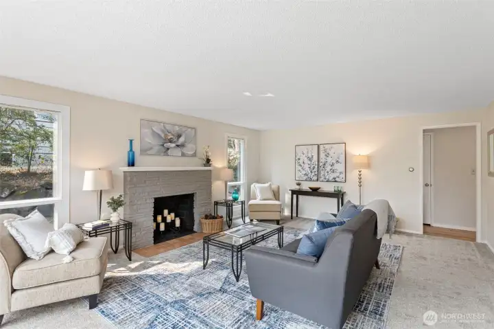 Freshly painted brick fireplace adds texture and character, even if not currently functional.