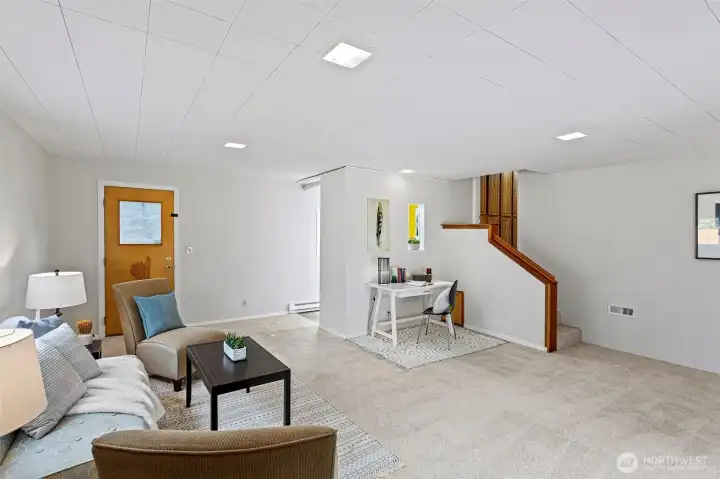 A wide-angle view of the flex room shows just how expansive this lower level is. It's roomy enough for multiple zones—movie nights, reading nooks, hobbies, or even workout space—all without disturbing the main floor above.