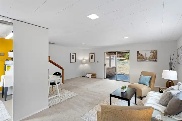 Sliding glass door offers direct access to the backyard and covered porch—perfect for indoor-outdoor flow. The door will need repair or replacement, offering an easy upgrade opportunity.