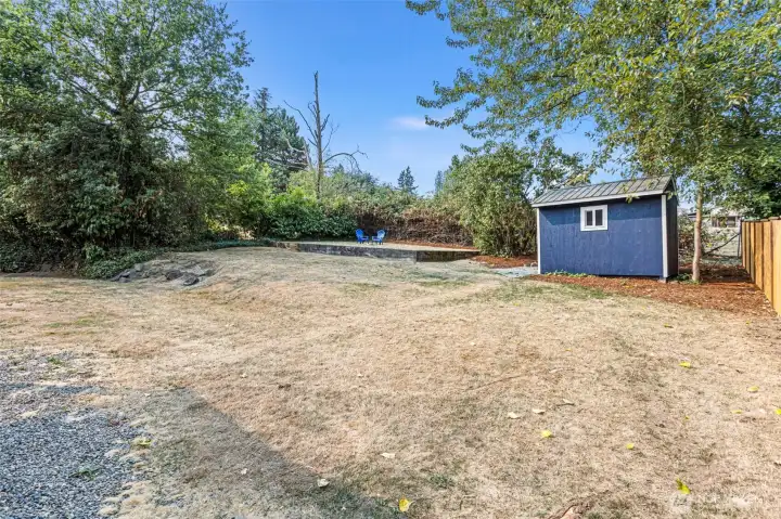 This large, terraced backyard is partially fenced, private, and full of potential—ideal for gardening, play, or entertaining.