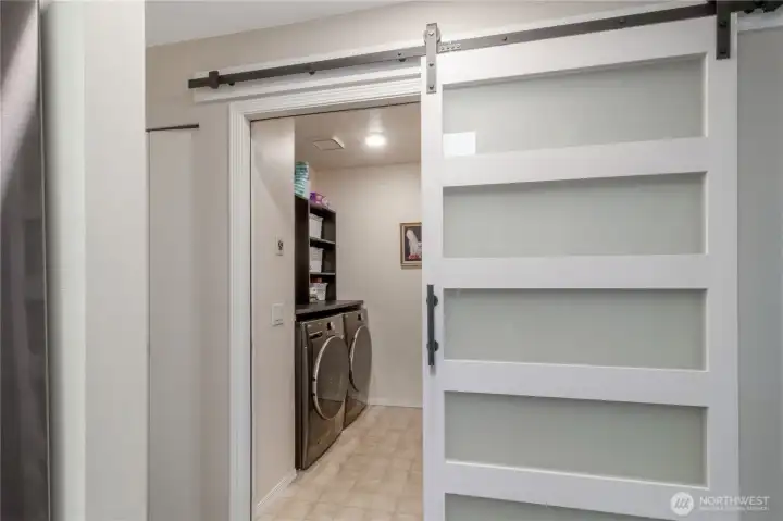 Custom barn door added for easier access to laundry room.