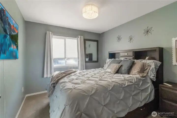 Primary bedroom with a dedicated electrical outlet for an A/C unit.
