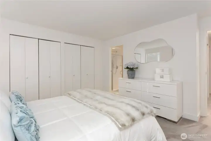 Another view of primary suite noting door to ensuite bath