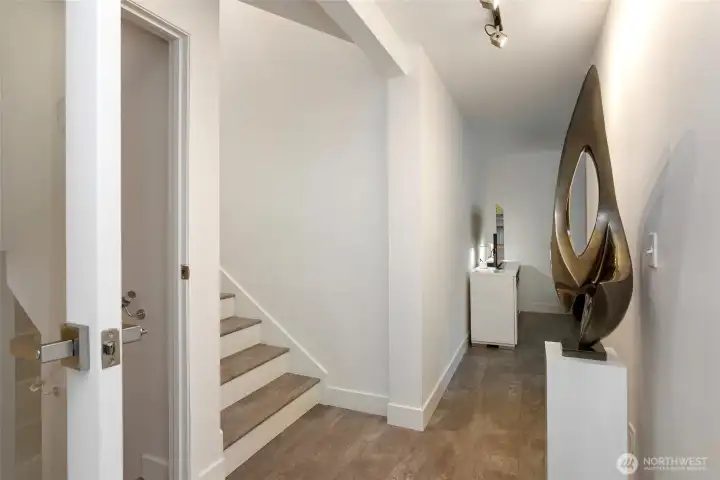 Landing facing into 2nd living room.  Door on left leads to lower level finished room and extra storage space