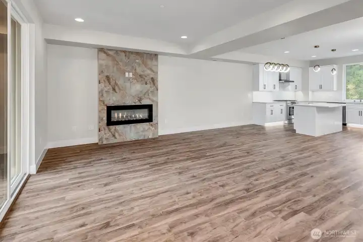 Welcoming living area on main floor with electric fireplace.