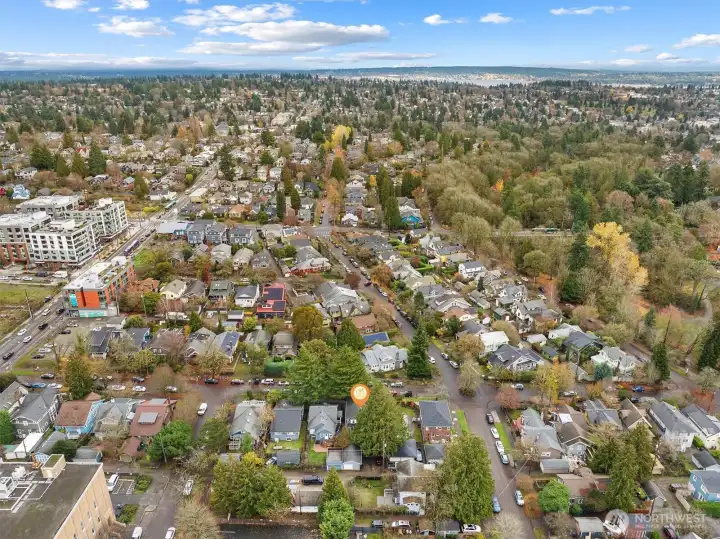 Aerial photo looking east. Sought after location. You can see Lake Washington from this photo. Walking distance to light rail, Whole Foods, cafes, restaurants and parks. Only minutes to UW, UW hospital, downtown, Amazon and 520. #1 sought after school cluster. 95 walk score, 91 bike score!