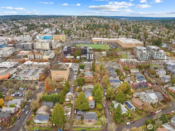 Aerial photo looking north. Sought after location. You can see the light rail station from this photo. Walking distance to light rail, Whole Foods, cafes, restaurants and parks. Only minutes to UW, UW hospital, downtown, Amazon and 520. #1 sought after school cluster. 95 walk score, 91 bike score!
