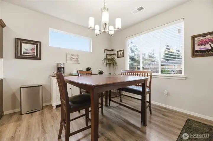 Large dining room off kitchen with door to covered patio and fully fenced yard