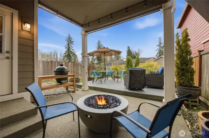 Cozy up by the fireplace in your backyard retreat