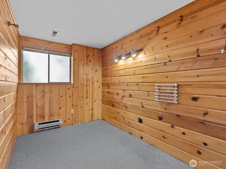 A cedar lined bedroom is a great spot for a home office or craft room.