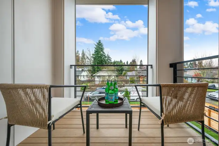 Covered deck off the main level provides a great place for morning coffee.