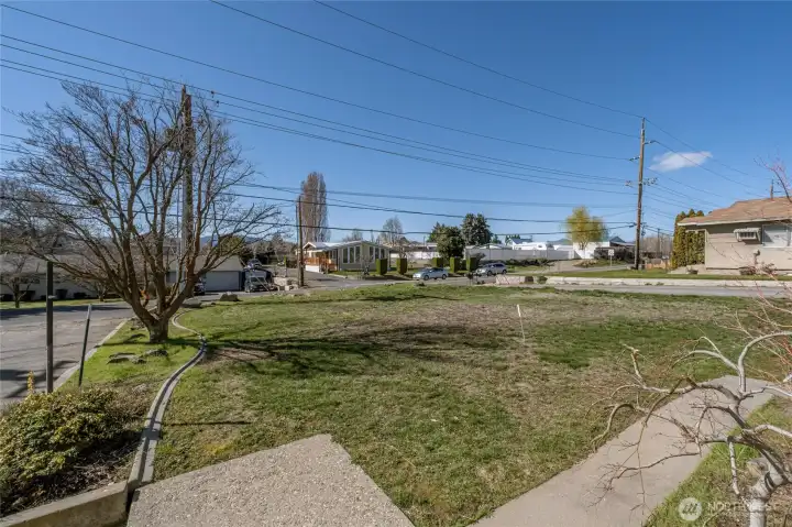 Looking from front steps to street and neighborhood