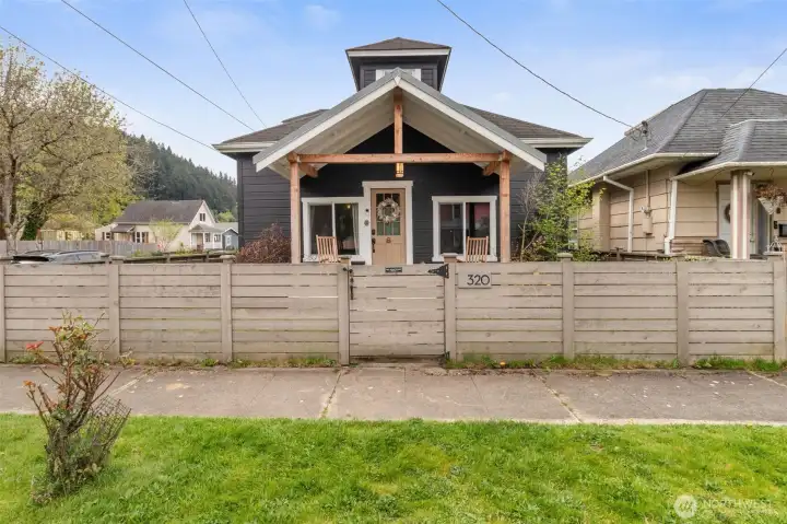 Embracing a Northwest inspired charm with the updated front porch creating inviting curb appeal.