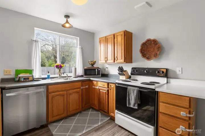Bright and practical kitchen space ready for your personal touches and favorite meals.