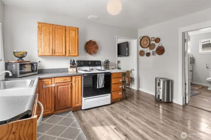 Functional kitchen with ample workspace and all appliances included.
