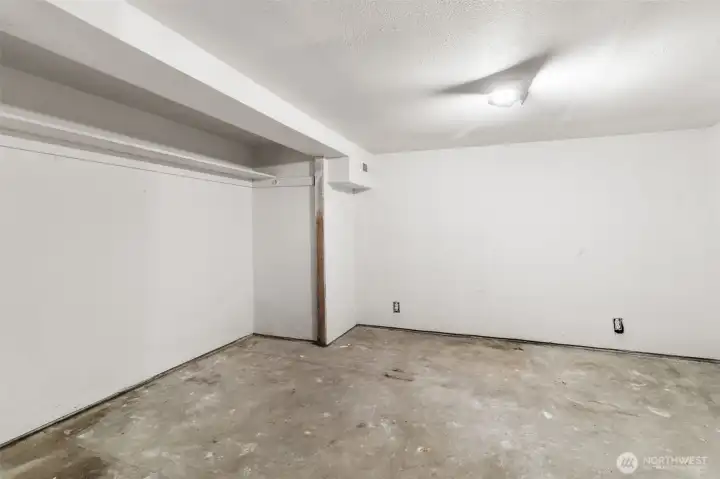 Create your ideal workspace or retreat with this finished basement room, perfect for office or hobby use.