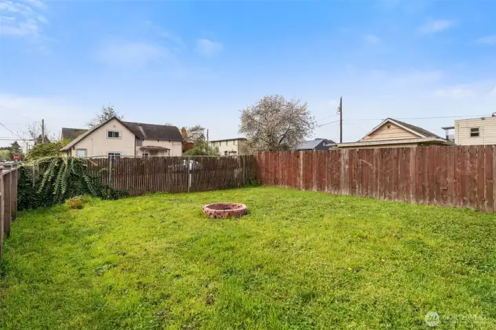 Fully fenced yard offering space to create your ideal outdoor setting or summer garden.