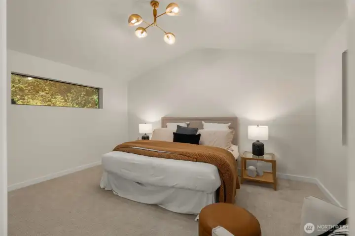 Primary Suite w/ vaulted ceilings and views to front and backyards