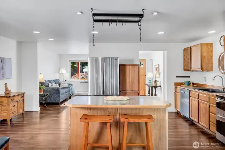 Opens to kitchen and family room