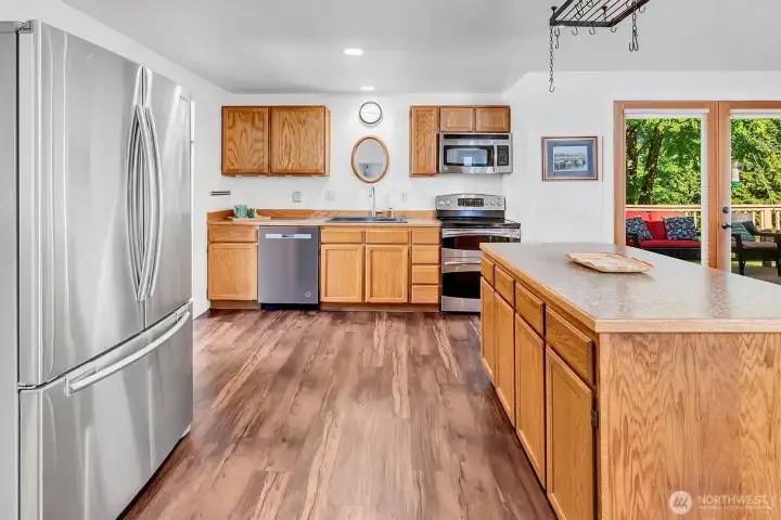Open concept kitchen flows easily to family room and outdoor entertainment space