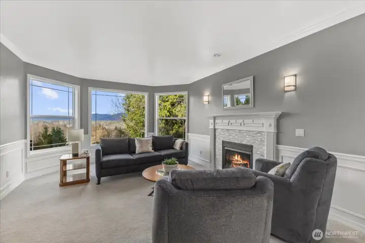 Living room with gas fireplace, mountain views