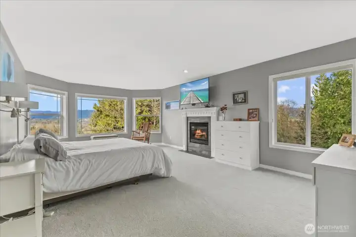 Main primary suite with gas fireplace, views of the mountains and valley. Stunning Sunrises