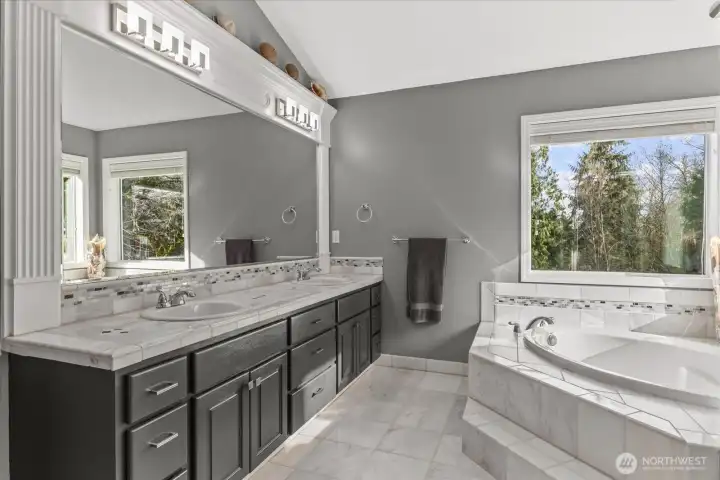 Primary Suite 5 piece bath with walk in shower, double sinks, dedicated room for toilet & walk in closet