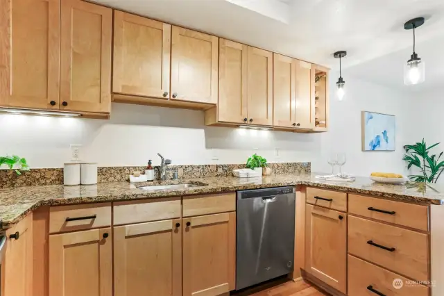 Upgraded dishwasher & modern cabinet hardware.