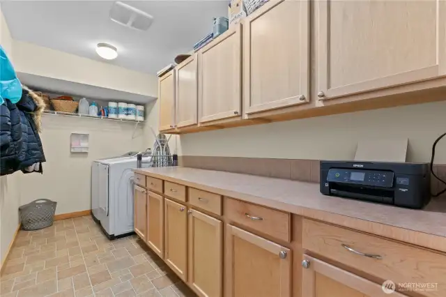 massive counter and storage in laundry room