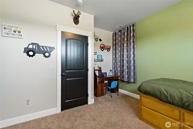 Entry to second bedroom with desk space.
