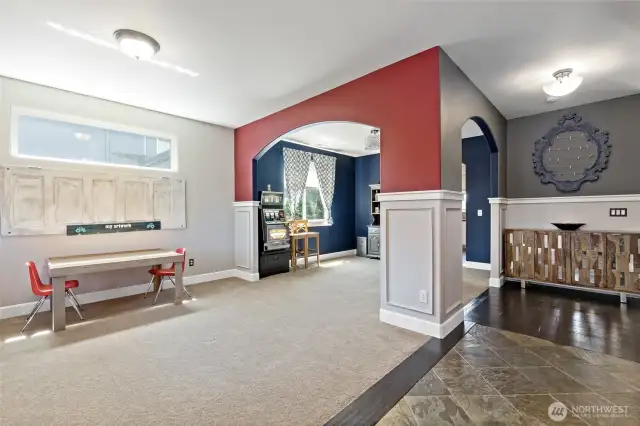 Living room off entry leading to the dining room off the kitchen.