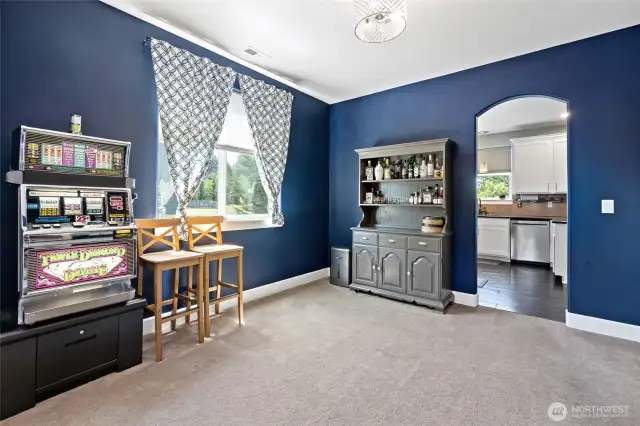 Dining room with archway to kitchen.