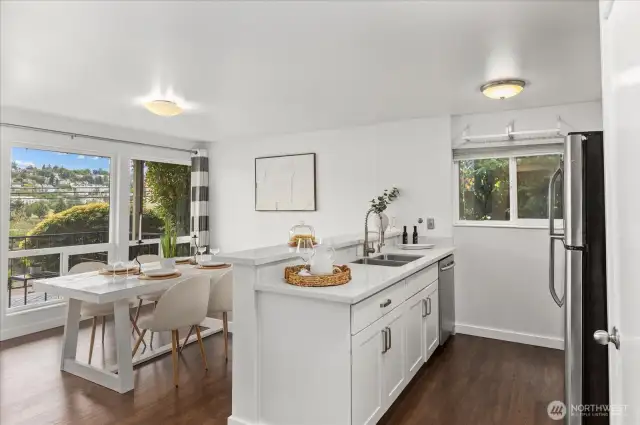 Full dining space beside kitchen.